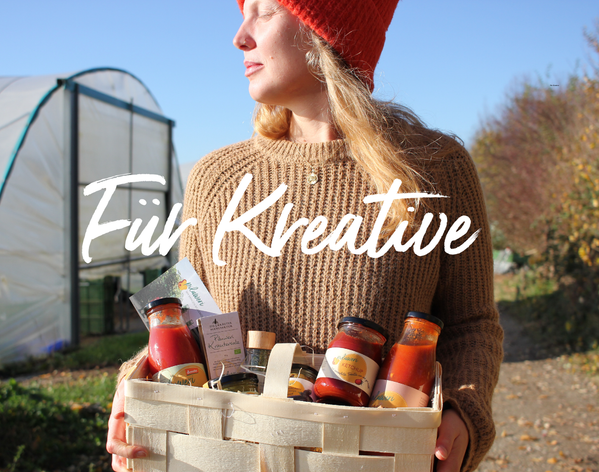 KI generiert: Person mit Korb voller Lebensmittel, Text: "Für Kreative".